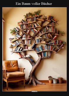 a tree that has books on it in the shape of a bookcase and is next to a chair