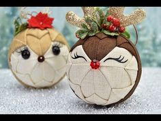 two christmas ornaments with reindeer antlers on them