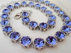 Handmade Tanzanite Blue Lace Filigree Platinum Plated 34 metal cups Art Deco Style Necklace made with Authentic Swarovski Crystal Elements. Great Sparkle Choose your pattern from drop down menu Also available in many other Crystal Colors, just email me for more information** Nickel Free Perfect for Bridesmaid gift too ** Crystal Color: Tanzanite Blue. Helpful tips for proper care: To avoid damaging or dulling Costume Jewelry, do not use jewelry cleaner or soak the jewelry in water. When dressing Art Deco Wedding Jewelry, Tanzanite Crystal, Clear Crystal Necklace, Girlfriend Anniversary Gifts, Crystal Colors, Tanzanite Necklace, Girlfriend Anniversary, Metal Cups, Swarovski Crystal Necklace