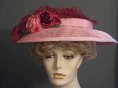 Handmade pink sinamay flat top hat, with large burgundy ostrich feather. Wired brim to hold shape. Pink grosgrain ribbon band encircles flat crown, and matching trim on brim. Three flowers in shades if pink, burgundy and a touch of green are the focal point. Millinery elastic attached to secure hat to head (worn under back of hair at nape of neck). I can add a metal Alice band instead if desired. Perfect derby hat, or garden party. Fits all head sizes. Vintage Pink Fitted Fascinator, Burgundy Summer Hat With Curved Brim, Summer Burgundy Hat With Curved Brim, Burgundy Curved Brim Summer Hat, Summer Burgundy Curved Brim Hat, Fitted Pink Mini Hat With Feather Trim, Vintage Pink Hat For Evening, Vintage Pink Evening Hat, Vintage Fitted Pink Hat