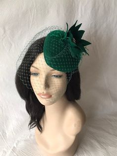 "Absolutely perfect for this season, is this wool felt Dark Forest Green Ladies cocktail Fascinators Hats ideal as a Formal Tilt Hats, Tea Party hat, Kentucky Derby Race Day Hat, Wedding Headpiece, Women's Church hat or any other special occasion, unique gift for the fashionista, mother, sister, wife and \"her\". EASY TO WEAR and HOW TO WEAR Simple and light weight with elastic band underneath and alligator clip to allow you the options and freedom to wear on both sides, in the middle for a vint Kentucky Derby Vintage Cloche Fascinator, Green Short Brim Costume Hat For Evening, Green Evening Headpiece With Short Brim, Green Short Brim Headpiece For Evening, Fitted Green Top Hat For Church, Green Evening Hat, Green Fitted Evening Hat, Green Fitted Top Hat For Church, Fitted Green Hat