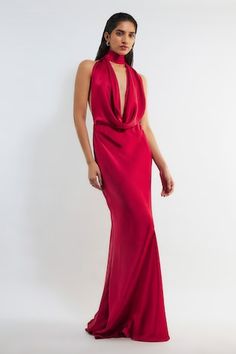 Red backless maxi dress with deep cowl neckline in satin base. - Aza Fashions Pre-draped Satin Maxi Dress With Cowl Back, Pre-draped Evening Dress With Cowl Back For Party, Pre-draped Halter Neck Evening Dress For Gala, Pre-draped Cowl Back Maxi Dress For Evening, Pre-draped Maxi Dress With Cowl Back For Gala, Pre-draped Cowl Neck Dress For Gala, Pre-draped Halter Neck Maxi Dress For Evening, Elegant Evening Halter Neck Pre-draped Maxi Dress, Glamorous Floor-length Satin Maxi Dress