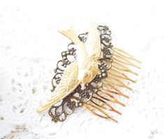 "Beautiful flying sparrow hair comb.. part of my Woodland Collection \"Behind The Shady Tree\" A gorgeous ox brass ornate filigree and golden brass sparrow make up this pretty Woodland hair comb The perfect way to accessorize! If you are a soon to be bride. This little darling would be the perfect finishing touch for your special day or your bridesmaids Comb is gold plated and nickel free Swallow/sparrow is raw brass Filigree is ox brass Comb measures 2\" X 1.5\" Sparrow measures 3.5\" More pret Flying Sparrow, Flying Swallow, Shady Tree, Hair Comb Bridal, Brass Filigree, Silver Flower Earrings, Hair Comb Wedding, Bridal Hair Comb, Rose Earrings