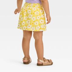 Your little one will move in comfort and style wearing this Mid-Rise Skirt from Cat & Jack™. Crafted from cotton-blend jersey fabric, this regular-fit skirt offers them all-day cool comfort, and it's designed with a full elastic waistband to offer them a secure fit. Falling above the knee, they can pair it with a variety of tees, tanks or sweatshirts for versatile outfit options. Cat & Jack™: Kids’ clothing with an imagination of its own. Smocked Skirt, Outfit Options, Fit Skirt, Cargo Skirt, Versatile Outfits, Fabric Tape, Girls Denim, Beautiful Skirts, Fitted Skirt