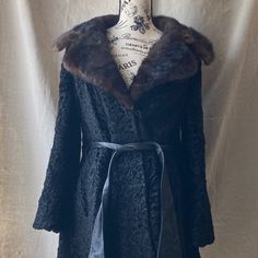 This Smashing Late 1960s Or Early 1970s Black Persian Lamb And Brown Mink Fur Coat Has An Amazing Shape, Wide Collar And Sleeves And A Leather Belt With Tapered Tips. This Is One Hot Coat And What Your Ultra Cool Mom Or Grandma Would Have Worn, But Her Mom Would Never Wear It. Persian Lamb Leather/Fur Body, Mink Collar And Leather Details, Trim And Belt. Has A Pocket On Each Side. From The Boston Store. In Overall Good To Well Loved Condition. She Has A Lot Of Life Left In Her But Needs A Little Fitted Winter Outerwear For Vintage Fashion, Vintage Winter Outerwear For Formal Occasions, Vintage Outerwear For Evening In Fall, Vintage Outerwear For Formal Winter Occasions, Vintage Formal Winter Outerwear, Vintage Fitted Winter Outerwear, Fitted Vintage Winter Outerwear, Fitted Vintage Fall Outerwear, Fitted Vintage Outerwear For Fall