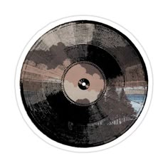 a black and brown record on a white background with an image of clouds in the sky