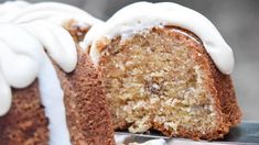 a close up of a cake with white frosting