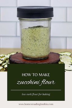 a jar filled with green stuff sitting on top of a table