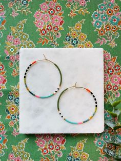 "This special collection focuses on color and pattern that will coordinate with any wardrobe. Tiny Miyuki glass beads were carefully chosen to give a variety of texture to this weightless hoop earring design.  The japanese glass beads, used. in every beaded hoop design we offer, are a world standard for their high quality, brilliance, and uniform shape.  If you love to accessorize, then don't delay! These were made for you! Choose from two sizes: Medium 35mm (1.38\") or Large 45mm (1.75\") round weightless gold filled hoops. Great for every day wearability. We aim to ship 2-3 times a week, and often have your purchase in the mail to you in less than 24 hours. Each purchase includes a gift box or cotton jewelry pouch. We recommend the following Care: - store your clean, dry jewelry in a box Bohemian 14k Gold-filled Beaded Earrings, Bohemian 14k Gold Filled Round Beaded Earrings, Handmade Multicolor 14k Gold Filled Jewelry, Handmade Adjustable Beaded Earrings In 14k Gold Filled, Bohemian 14k Gold Filled Earrings With Tiny Beads, Handmade 14k Gold Filled Round Beaded Earrings, Handmade Adjustable 14k Gold Filled Beaded Earrings, Beaded 14k Gold Filled Hoop Earrings, Bohemian Heishi Beads Hoop Earrings As Gift