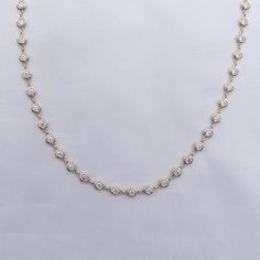 This exquisite 3 3/4 Carat round moissanite diamond necklace features a delicate link chain and a bezel-set design. Expertly crafted with lab-created diamonds in 10K or 14K solid gold and 925 sterling silver, this piece radiates luxury and sophistication. The perfect addition to elevate any outfit. Model No : CSSN1523 Link Chain Necklace, Diamond Chain, Round Moissanite, Moissanite Diamonds, Chain Link Necklace, Lab Created Diamonds, Diamond Clarity, Set Design, Bezel Setting