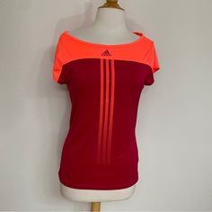 Nwt Adidas Climacool Tennis Work Out Tee. Cute Cutout In The Back. Neon Orange/Pink And Magenta. Workout, Gym, Tennis, Active, Athleisure, Walking, Running, Streetwear, Urban, Summer, Spring, Fall And Winter. Brand New- There’s Some Little Marks That Should Come Out When Washed. Size Medium Casual Breathable Adidas Tops, Pink Sportswear T-shirt For Workout, Pink Short Sleeve Sportswear T-shirt, Pink Adidas Moisture-wicking Activewear, Adidas Pink Moisture-wicking Activewear, Adidas Three Stripes Tops For Gym, Adidas Pink Activewear For Training, Adidas Breathable Tops For Training, Adidas Moisture-wicking Stretch Tops