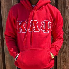 Exclusive Kappa Alpha Psi Double Stitched Appliqué Embroidery Lettered Hoodie. This is the perfect long-sleeved hoodie to wear while showing off your Kappa Alpha Psi fraternity lettering. A comfortable 100% cotton tee with a twill Greek letters embroidery across the chest give you the perfect fit. This hoodie is also a perfect gift for your favorite Kappa Man. ** Fits Slim - you may wish to purchase a size larger than your normal size to maximize your comfort. Fast Shipping & Processing: 1-2 day Cotton Hoodie For Fan Gear, Cotton Hoodie With Double-lined Hood For Fan Gear, Collegiate Fleece Hoodie, Game Day Fleece Hooded Hoodie, Game Day Fleece Hoodie, Collegiate Fleece Hooded Hoodie, Cotton Hoodie With Drawstring For Game Day, Red Fleece Hoodie With Double-lined Hood, Fleece Hoodie With Double-lined Hood For College