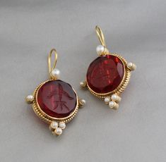 Description Gemstone - Red Glass Material - Brass Gemstone Size - 18 mm Earring Height Including Hoop - 4 cm Earring Width - 2 cm Finish - Smooth and high polished with Little Oxide Antique Look. Note -The earrings are made to order, production day is about 3-5 working days. The one you receive may be slight different from the one in the picture due to handmade nature, but it will be almost same as in the above picture.These pieces are handcrafted from start to finish and have an imperfect handmade look.These earrings are the perfect addition to your collection. Our rings are meant to be classic enough for everyday wear or to give as a bridesmaid gift. You will receive the same piece as in the picture or identical. Since all gemstones are different from each other, I cannot guarantee that Clip-on Round Crystal Earrings For Gifts, Gift Crystal Clip-on Round Earrings, Clip-on Crystal Earrings As Gift, Gift Crystal Clip-on Earrings, Gift Round Clip-on Crystal Earrings, Red Ear Wire Earrings For Wedding, Red Pierced Earrings For Wedding, Red Pierced Earrings For Formal Occasions, Red Pierced Wedding Earrings