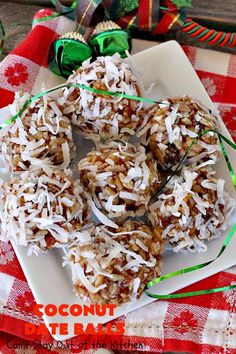 coconut bites are arranged on a white plate with green ribbon and candy canes in the background