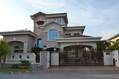 a large house with a gate in front of it