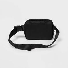 Why we're ALL IN: Fanny pack is perfect for carrying small essentials while working out or on the go. The main body is made from water-repellant 100% recycled polyester fabric, and it boasts a top zipper closure with inner phone pouch plus a smaller outside zippered pocket to keep small items like keys and snack bars secure and close at hand. Use the adjustable buckle waist strap to find the perfect fit. All in Motion™: Made for every move, priced for every day. Sporty Nylon Belt Bag For Sports, Functional Black Nylon Chest Bag, Functional Sports Belt Bag With Cell Phone Pocket, Functional Belt Bag With Cell Phone Pocket For Sports, Practical Nylon Chest Bag For Streetwear, Sporty Everyday Nylon Belt Bag, Black Nylon Chest Bag For Streetwear, Sporty Nylon Belt Bag For Everyday, Casual Black Nylon Belt Bag