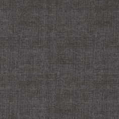 dark grey fabric textured upholstered to the wall