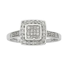 a white gold ring with square shaped diamonds on the band and shoulders, set in 18k white gold