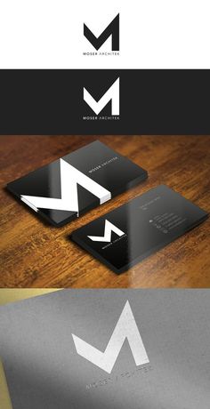 some business cards with the letter m on them