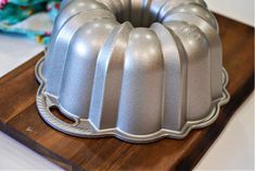 a bundt cake sitting on top of a wooden cutting board