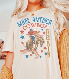 This Gender-Neutral Adult Graphic Tees item by WildSageClothingCo has 26 favorites from Etsy shoppers. Ships from El Paso, TX. Listed on May 29, 2023 Patriotic Western Outfit, Make America Cowboy Again, Golden Sky, Christian Shirts Designs, Western Vibes, Western Tee, Western Graphic Tees, Rodeo Shirts, Cowboy Shirt