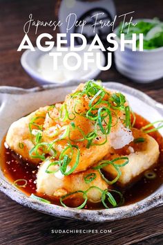 japanese deep fried tofu with vegetables and sauce in a bowl