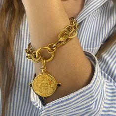 Large coin bracelet large size steel chains and closure bracelet . it is decorated with an oversized coin made of gold plated 24 k zamac .  coin can be removed and bracelet can be worn also as plane chains Bracelet or you can add more charms in it .  it is available in various sizes .  18cm equals 7 inches ( small )  19 cm equals 7.48 inches  ( regular choice )  20 cm  equals 7.87 inches ( regular loose )  21 cm equals 8.26 inches  ( large )  22 cm equals 8.66 inches  ( xl ) 💙in my collection y Coin Charm Bracelet, Double Chain Bracelet, Coin Bracelet, Coin Jewelry, Double Chain, Matching Necklaces, Steel Chain, Charm Bracelets, Chain Bracelet