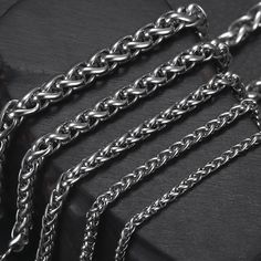 Add bold drama to designs with the stainless steel wheat chain. This chain features a style similar to snake chain, with interlocking links that create a continuous, almost solid look. This sturdy chain is perfect for using with heavier components. It would make a great foundation for large-hole bead projects. Add a pendant for a simple, stand-out display. This chain features a dark silver shine that would work well with bright colors like red, purple or orange. Width: 2.5mm / 3mm / 4mm / 5mm / Metal Wheat Chain Link Necklace, Stainless Steel Wheat Chain Necklace, Gift Stainless Steel Wheat Chain Necklace, Necklaces For Men, Bead Projects, Large Hole Beads, Metal Products, Black Jewelry, Metal Charm