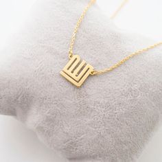 This necklace is a piece of our new collection of Allah necklace made from sterling silver and 14k gold. The collection includes different designs that suit all tastes Kufi/calligraphy, heart/rectangle/triangle shapes, tiny/big sizes. Here is the link for the full collection: https://etsy.me/2Swd0lPAll the designs can be made as necklace, bracelet, and earrings. If you also want a complete set that includes a necklace, a bracelet and earrings please get in touch with us. We accept custom orders! Fine Jewelry Square Pendant Necklace For Gift, Gold Sterling Silver Custom Necklace For Gift, Symbolic Jewelry With Delicate Chain For Gift, Gold Sterling Silver Custom Necklace As A Gift, Symbolic Gold Initial Pendant Necklace, Symbolic Jewelry As A Gift With Delicate Chain, Symbolic Jewelry Gift With Delicate Chain, Minimalist 14k Gold Necklace For Mom, 14k Gold Initial Necklace With Clavicle Chain As Gift