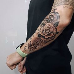 a man with a rose tattoo on his arm