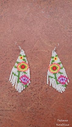 These handmade unique earrings with abstract floral print are made of high-quality Czech beads and strong synthetic thread. They are elegant, fashionable, and highly versatile, suitable for everyday wear. Color: white,pink,red,orange, green . 100% hand made with love! Traditional White Chandelier Earrings, White Beaded Earrings For Festivals, White Handmade Adjustable Earrings, White Beaded Earrings For Festivals Gift, White Beaded Earrings For Festivals And Gifts, Traditional White Earrings With Ear Wire, Traditional White Chandelier Earrings As Gift, Handmade White Jewelry For Summer, Traditional White Chandelier Earrings For Festivals