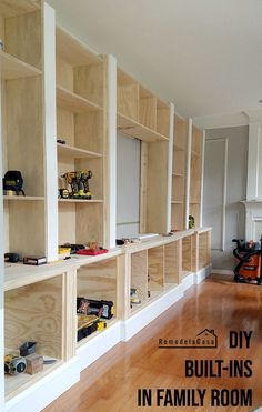 the room is filled with built in bookshelves