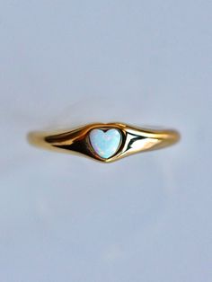 Perfect for every day, every look, and every aesthetic, the Opal Signet Ring is the perfect piece for any ring collection! The classic signet style is updated with a touch of Serendipity magic with a mesmerizing yet dainty opal heart taking center stage. Understated yet eye-catching, the opal signet ring is perfect for any stacked ring look or as a stand alone stunner. 💕 Don't know your ring size? View our Ring Size Guide …………………………………. RING SIZE & MATERIAL❋ water resistant 14k gold plated stai Elegant Everyday Heart-shaped Ring, Everyday Stackable Opal Ring, Classic Tiny Heart Jewelry, Signet Ring Aesthetic, Classic Heart Shaped Rings For Everyday, Classic Heart-shaped Rings For Everyday, Classic Opal Open Ring As Gift, Classic Opal Open Ring Gift, Classic Open Opal Ring As A Gift