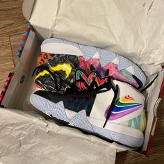 a pair of colorful sneakers in a box