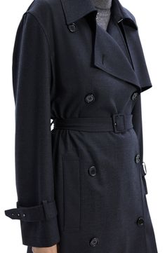 Be undercover chic in this longline trench designed in a double-breasted silhouette with a slender defining belt. Double-breasted button closure Notched lapels Belted cuffs Removable belt Front slant pockets Unlined 40% wool, 29% polyester, 28% viscose, 3% spandex Dry clean Imported Classic Fitted Outerwear With Belt Detail, Classic Formal Outerwear With Belt Detail, Fitted Pea Coat With Belted Cuffs For Work, Classic Office Pea Coat With Belted Cuffs, Formal Double-breasted Outerwear With Belt Loops, Elegant Fitted Pea Coat With Belted Cuffs, Business Pea Coat With Belted Cuffs And Lapel Collar, Classic Outerwear With Self Belt For Office, Fitted Belted Pea Coat For Office