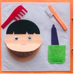 a child's artwork made out of felt with scissors and toothbrushes