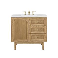 a bathroom vanity with two faucets on the top and one sink below it