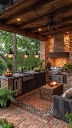 an outdoor kitchen is lit up with candles