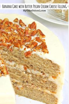 there is a cake with white frosting and nuts on the top, as well as one slice missing from it