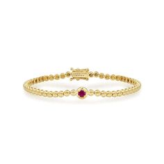 Crafted in 18-karat yellow gold, this Mini Bezel Tennis Bracelet is accented with an illusion set Ruby at the center. One of our favorite bracelets, it makes a stunning statement when worn alone or layered with other pieces from our collection. Wear yours as a signature piece, day to night and everywhere in between. Bracelet measures 6.5 inches in length Ruby accent measures 0.25" x 0.25" Each mini bezel measures 2.80 mm x 2.80 mm Push Clasp Fastening with Safety Made with love in Los Angeles Co Collection Letter, Set Bracelet, Ear Stack, Day To Night, To Night, Tennis Bracelet, Ring Bracelet, Men Necklace, Favorite Things Gift