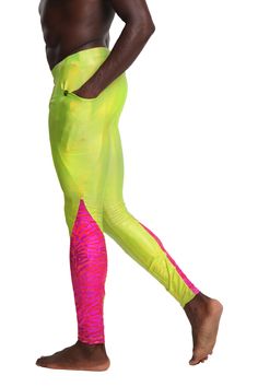 Tropic like its hot in the Limelight Meggings. Your neon dreams have come true in these bright AF neon green mens leggings. Bonus they are blacklight responsive so they will give you the glow at fluro party. FEATURES: Holographic neon green chartreuse spandex and contrast panels in holographic hot pink tiger print spandex UV Glow blacklight responsive fabric Contouring panels at the calf and thigh Two side pockets deep enough for a cell phone and wallet Made with the highest quality 4 way stretc Sporty Neon Stretch Bottoms, Neon Sports Bottoms, Sporty Neon Bottoms For Sports, Neon Yellow Stretch Workout Bottoms, Fluro Party, Rainy Festival Outfit, Neon Rave Outfits, Beach Festival Outfit, Pink Tiger Print