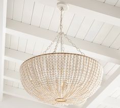 a white chandelier hanging from the ceiling