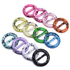 six different colored plastic rings on a white background