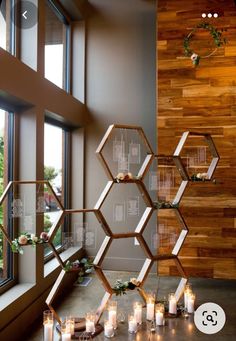 candles are arranged in hexagonal shapes on the windowsill