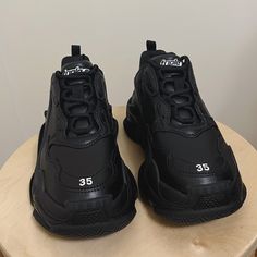 Authentic Balenciaga Triple S Sneaker In Black (Faux Leather) Brand New, Never Used! Size Eu 35/Us 5 (Narrow 6 Or 5.5 At Best) Comes With Original Box, Dust Bag, And Spare Laces. Still Up For Sale On Original Site! Feel Free To Make An Offer! Black Pointed Toe Synthetic Sneakers, Black Pointed Toe Sneakers With Rubber Sole, Black Designer Synthetic Sneakers, Black Pointed Toe Sneakers With Branded Insole, Balenciaga Triple S White, Balenciaga Race Runner, Balenciaga Track Sneaker, Balenciaga Sock, Balenciaga Track Sneakers