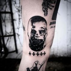 a man's arm with a black and white image of a person on it