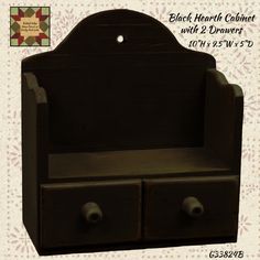 an old wooden chair with two drawers on it's sides and the words black heart cabinet