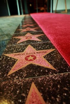 the hollywood walk of fame stars are lined up on the floor with red carpeting