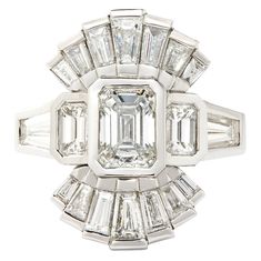 an art deco style diamond ring with baguetts in the center and side stones