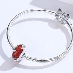 This is charm only bracelet is sold separately. Elegant red color diamond cut texture Murano glass bead charm for Pandora style bracelet, features tiny butterflies decoration, made of solid 925 sterling silver with platinum plating and high quality glass crystal. Upgrade your bracelet game with this stunning Red Murano butterfly glass bead charm! Its dazzling diamond cut texture, elegant red color, and intricate tiny butterfly decorations make it a must-have for any Pandora style bracelet. Craft Elegant Butterfly Charm For Gift, Cubic Zirconia Charm Bracelet Gift, Cubic Zirconia Jewelry With Removable Charms For Gift, Round Charm Bracelet With Faceted Beads, Round Charm Bracelet With Faceted Beads For Gift, Elegant Jewelry With Butterfly Charm And Round Beads, Elegant Cubic Zirconia Charms For Jewelry Making, Elegant Round Gemstone Charms, Elegant Silver Gemstone Charm Bracelet